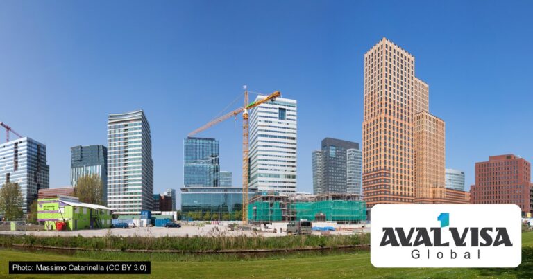Office towers of the Zuidas business district in south Amsterdam under a clear blue sky